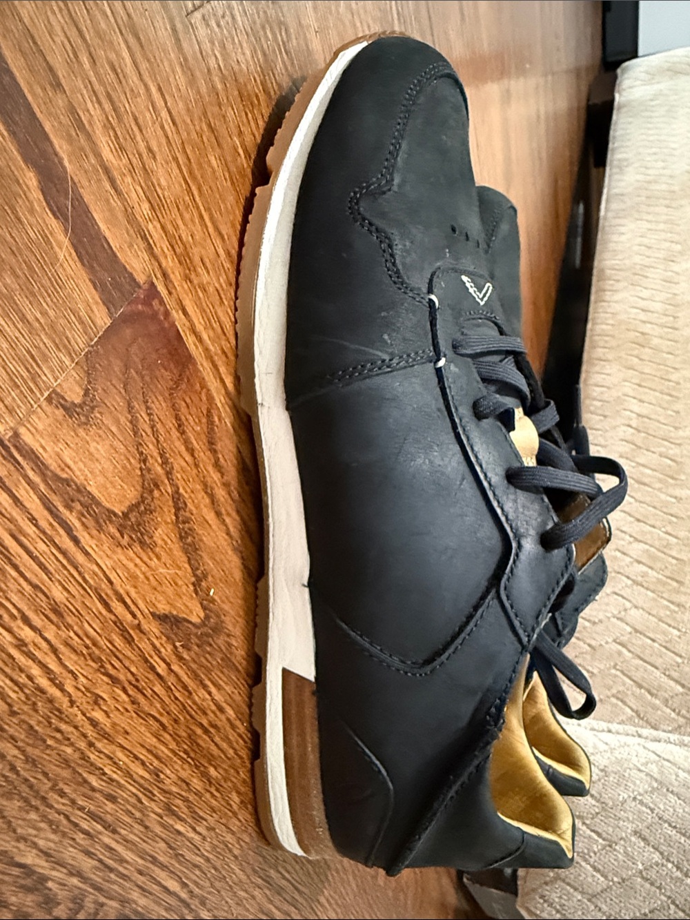 OluKai Men's Black Leather Sneakers with Gold Accents